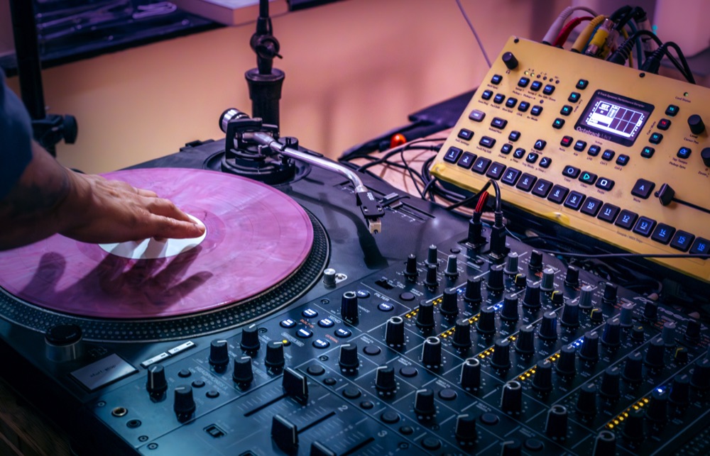 Synths and drum machines on the studio desk