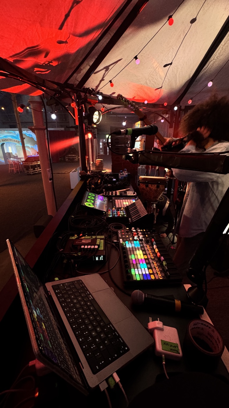 Playback rig with laptop and controllers at a live show